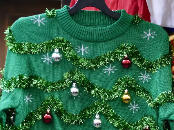 Beautiful or ugly: green Christmas sweater with decor balls