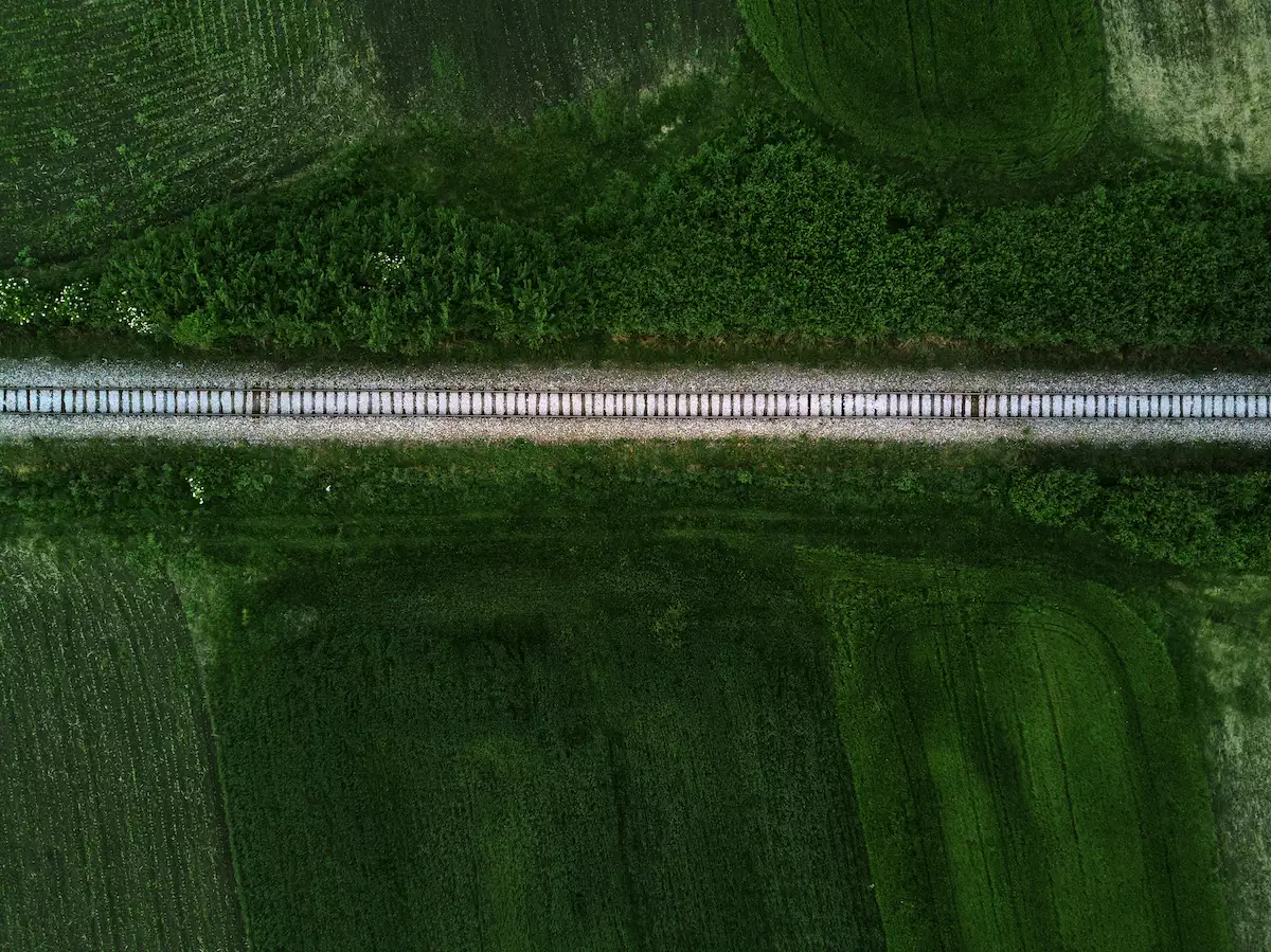 Aerial view of railway track through countryside, drone pov
