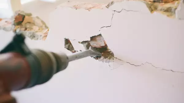 Construction worker using pneumatic hammer