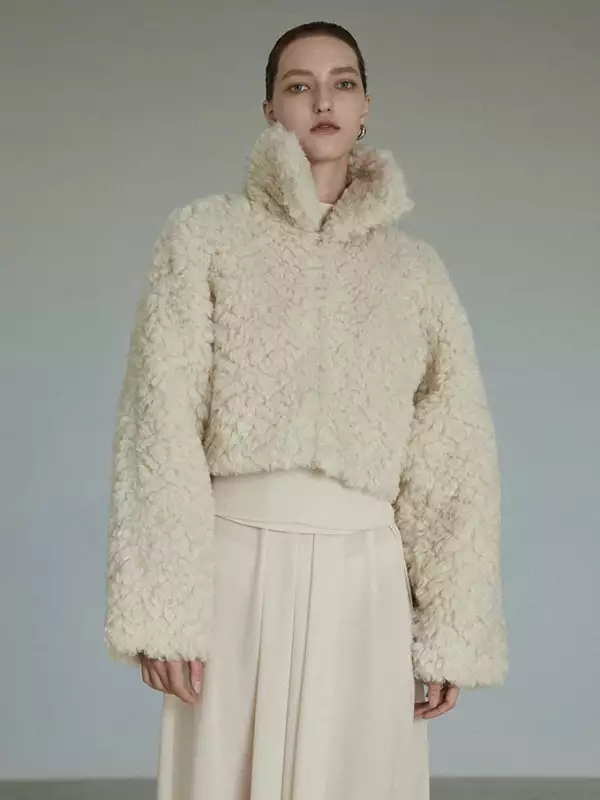 wearing a cozy beige jacket.jpg