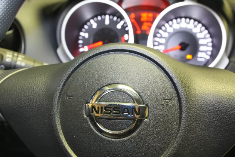 Nissan logo on a car steering wheel