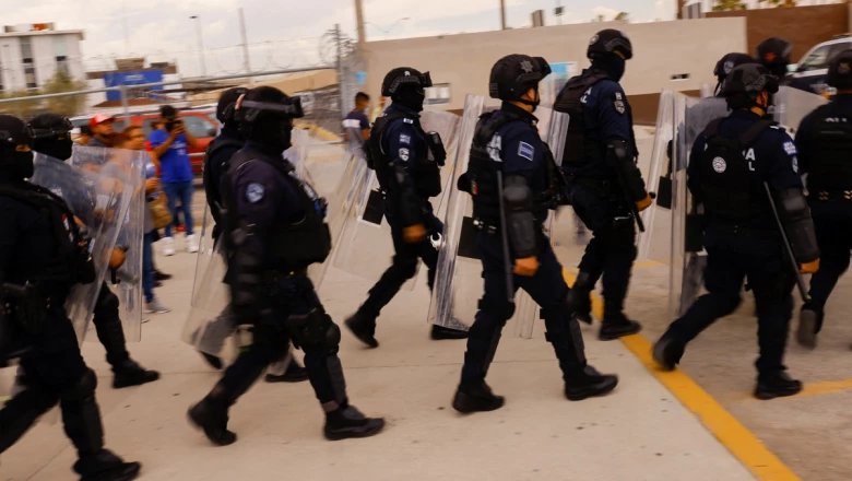 Security arrive to a prison following a fight between imprisoned members of rival gangs