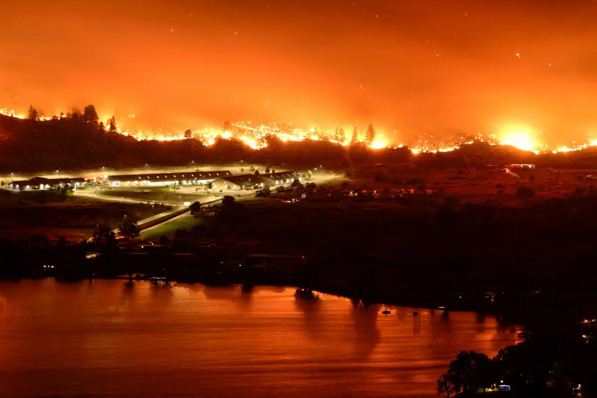 A long exposure image shows the Eagle Bluffs Wildfire, which crossed the border from the U.S. state of Washington, and prompted evacuation orders in Osoyoos, British Columbia, Canada, July 30, 2023. REUTERS/Jesse Winter