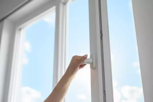 Woman opening window
