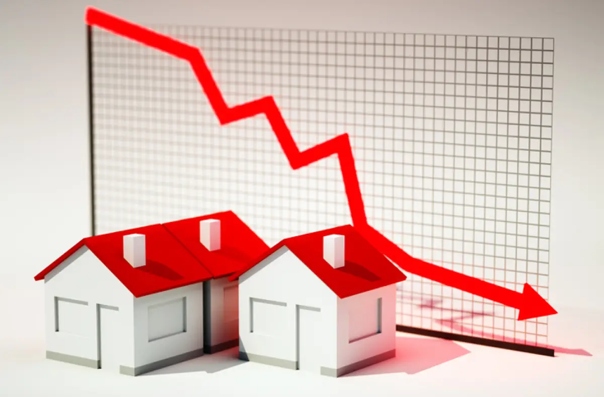 3d image of house with graph falling