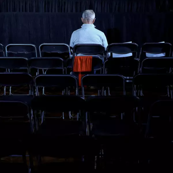 A man waits before the rally for Democratic presidential candidate Pete Buttigieg at Drake University in Des Moines in Des Moines, Iowa, U.S.,