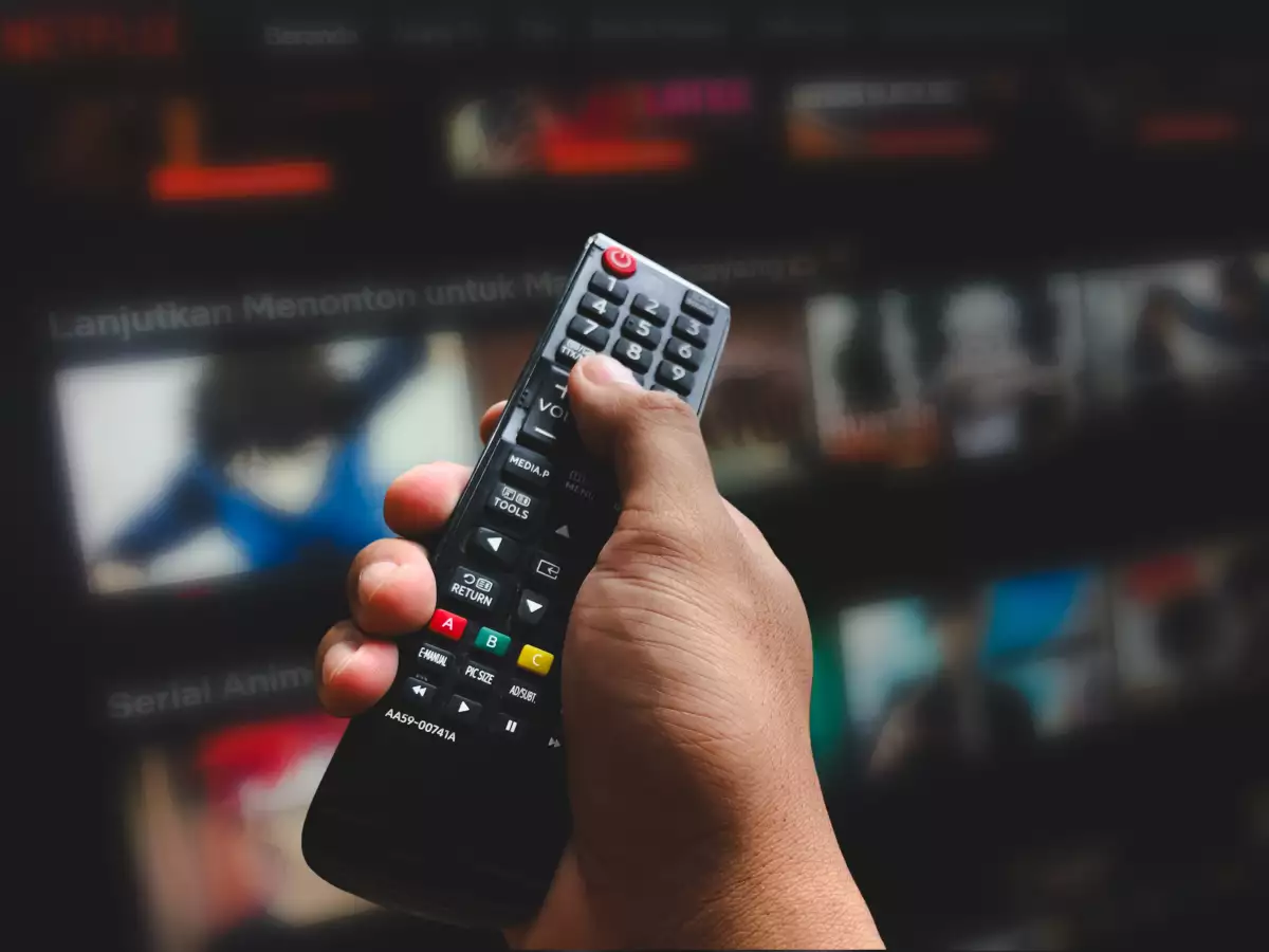 In,This,Photo,Holding,Remote,Control,With,Netflix,Logo,In