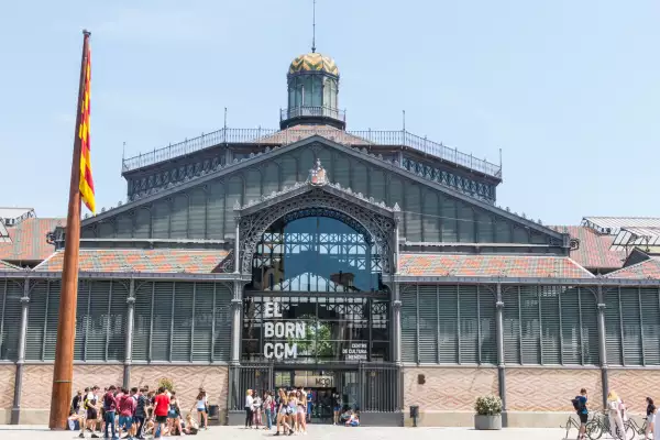 Tourits from the facade of Born market. It is an example of iron architecture, a movement within the modernist. Born district. Barcelona, Catalonia, Spain