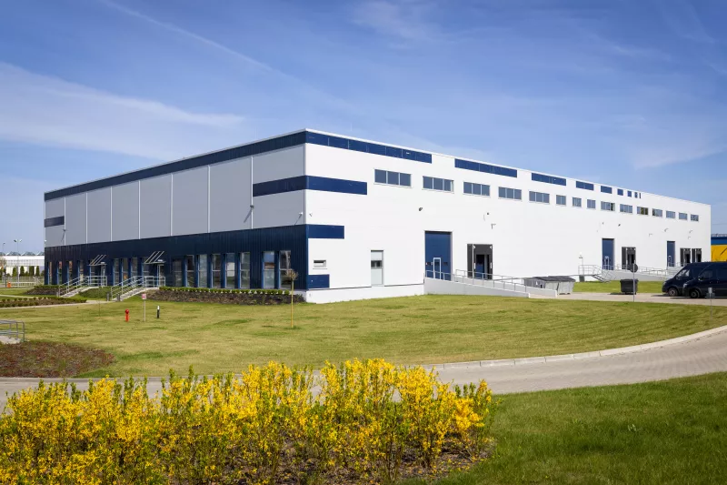 Drive way to large distribution warehouse building