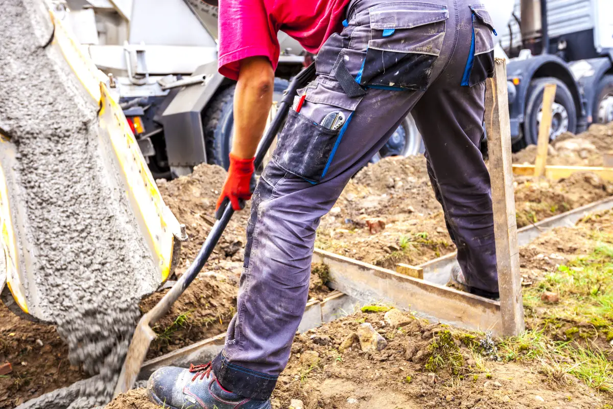Pouring concrete to the foundations of the building